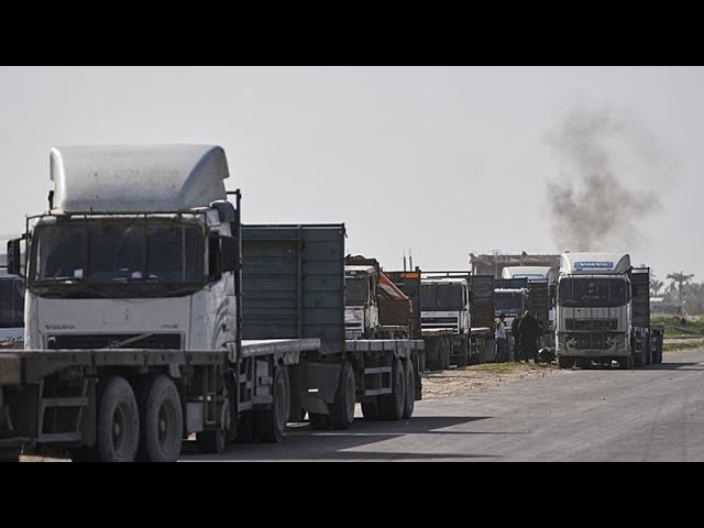 Aid trucks enter the Gaza Strip via the Rafah crossing with Egypt